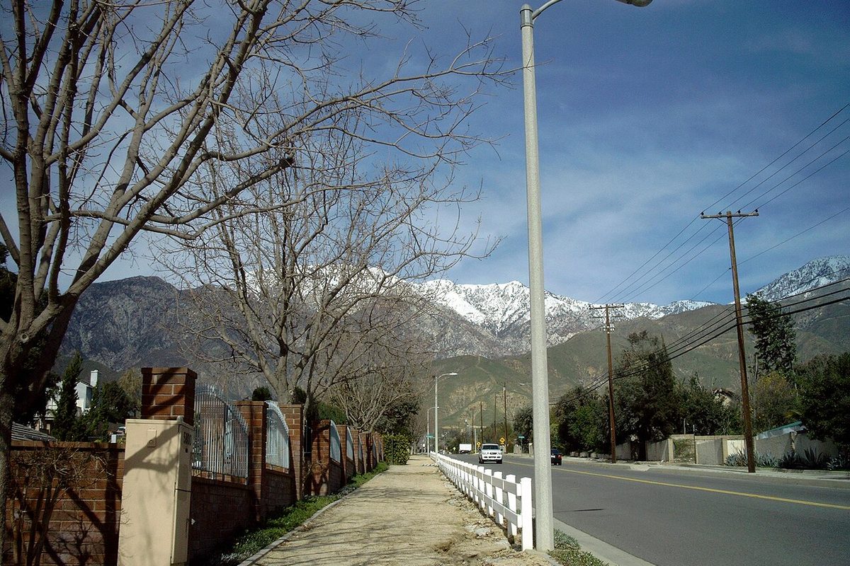 Snow-capped San Gabriel Mountains above a street in the Alta Loma area of Rancho Cucamonga, California